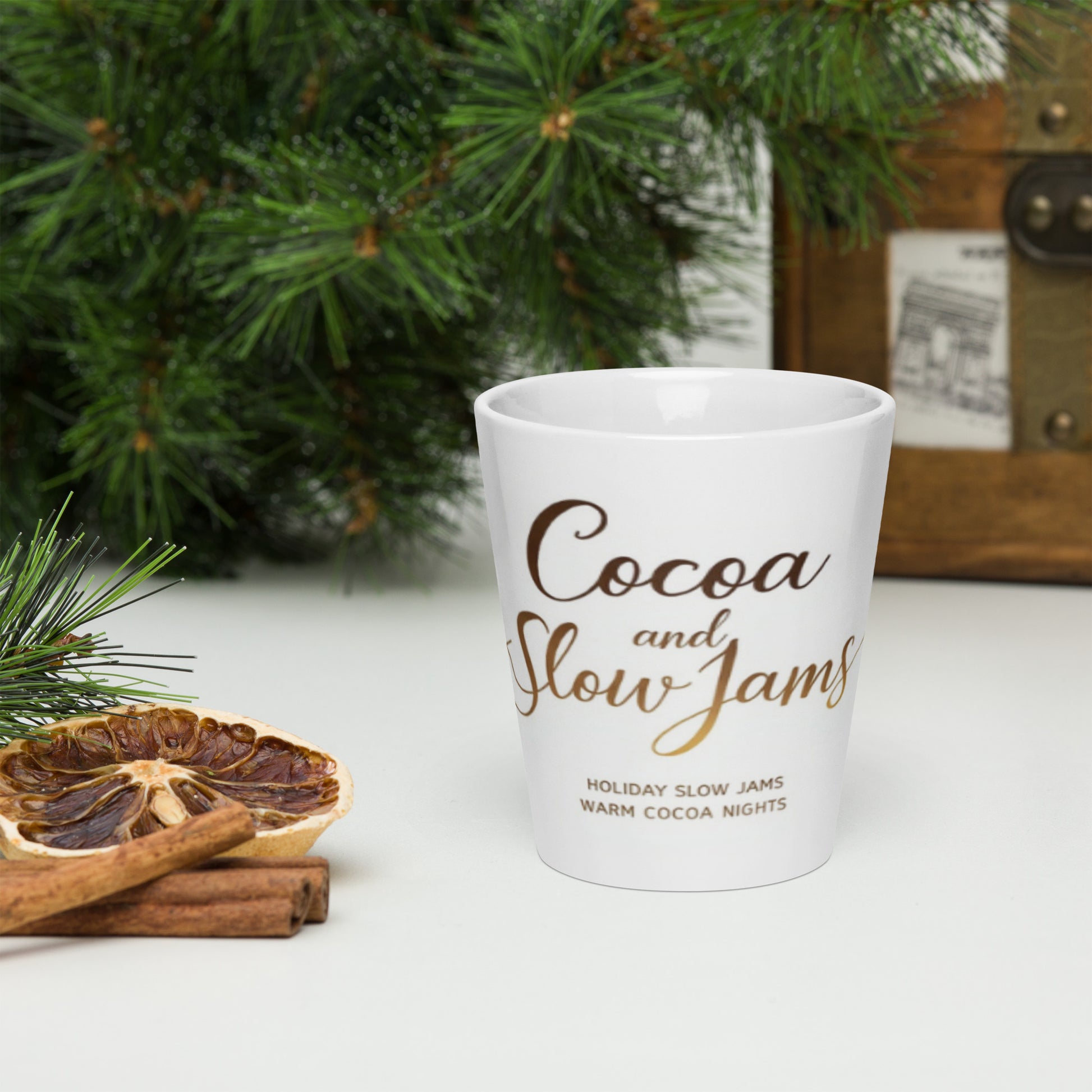 “Cocoa and Slow Jams Latte Mug – white ceramic mug with cocoa-brown logo,”